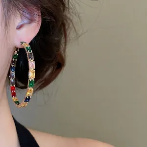 Elegant gold hoop earrings with multi-colored rectangular cubic zirconia crystals