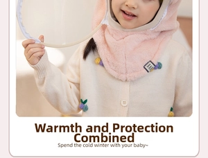 Pink plush kids winter hooded scarf with a clear face shield and colorful pom poms