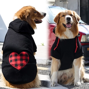 Detail showing red and black plaid heart patch on a black hooded pet sweater for large dogs