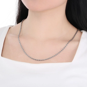 Close-up of 3mm silver twist rope chain necklace worn on neck for a stylish accessory look