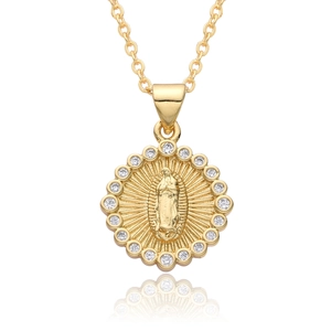 Macro detail of 18k gold plated Virgin Mary pendant with sparkling zircon borders
