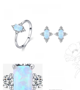 Macro detail of S925 sterling silver ring and earrings set with blue rectangular opal