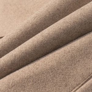 Macro shot of high-quality camel wool blend fabric texture with soft fiber details