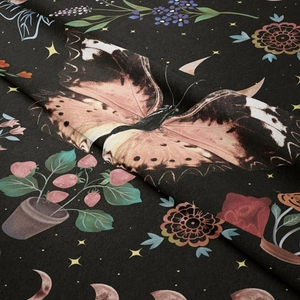Close-up of velvet butterfly tapestry fabric showing detailed floral print and soft texture