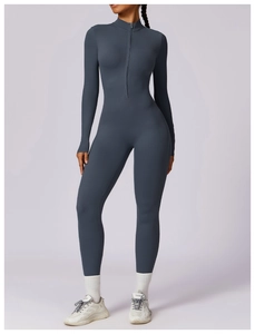 Close-up of seamless dark blue yoga bodysuit with stand collar and front zipper detail