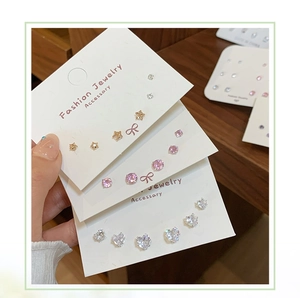 Detailed view of luxury zircon stud earring set with star, heart, and round shapes