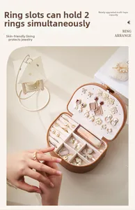 Internal layout of brown PU leather oval jewelry box with ring slots and earring plate