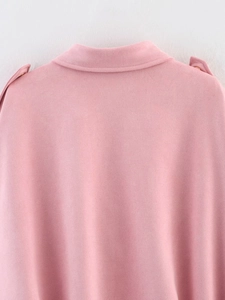 Close-up of pink faux suede jacket showing collar details and shoulder epaulettes