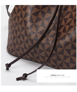 Detailed macro view of geometric pattern and textured coating on large bucket tote bag