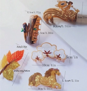 Detailed view of acetic acid hair clips in squirrel, stump, and leaf shapes with dimensions
