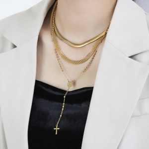 Three-layer gold stainless steel necklace set with flat snake chain and cross pendant
