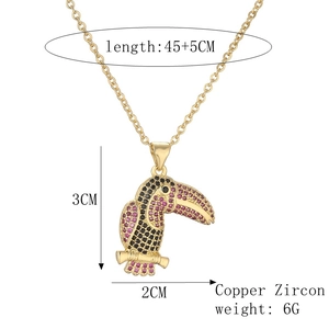 Detail view of toucan pendant necklace with size specs: 45+5cm length and 3x2cm dimensions
