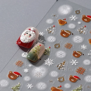 3D embossed Christmas nail art stickers featuring Santa, snowmen and golden snowflakes