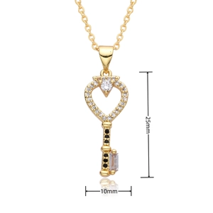 Detail view of 18k gold heart key pendant with crystals and dimensions 25mm by 10mm