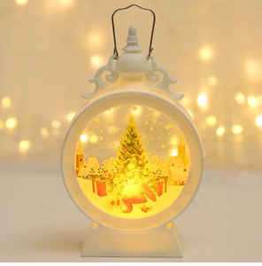 Detail of Christmas lantern with miniature tree and warm LED light in round window