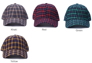 Detailed view of plaid cotton baseball caps in khaki, red, green and yellow colors