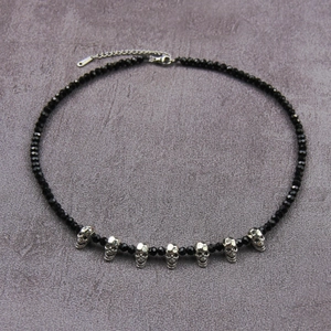 Gothic black beaded necklace with silver skull charms and adjustable lobster clasp