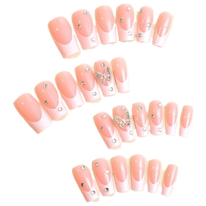 Pink French press-on nails set with gradient tips, silver butterfly charms and rhinestones