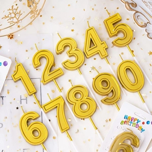 Golden number candles set from 0 to 9 for birthday cake decoration with crown accents