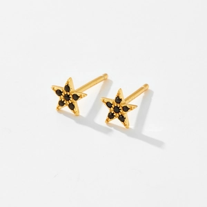 Elegant gold S925 silver star stud earrings with black zircon stones in a minimalist style