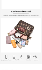 Spacious interior of brown monogram handbag showing capacity for tablet, phone, and makeup