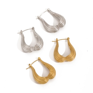 Modern U-shaped textured gold and silver hoop earrings with vertical pleated metal finish