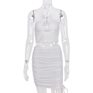 Chic two-piece set featuring a white halter cutout top and drawstring ruched bodycon skirt