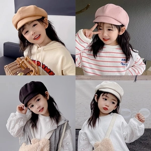 Detail view of thickened plush winter hats in khaki, pink, black, and beige colors