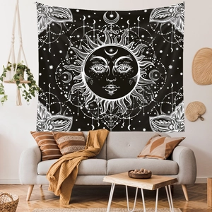 Bohemian sun and moon tapestry with celestial mandala pattern in a modern living room