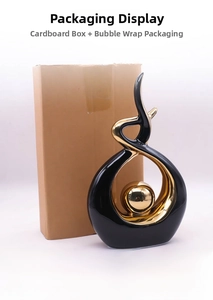 Macro shot of modern flame ceramic sculpture with sleek black glaze and gold interior
