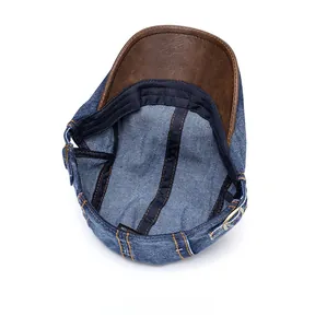 Internal structure of denim newsboy cap showing 100% cotton lining and stitching