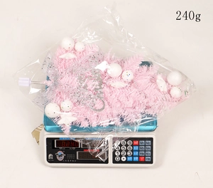 Measurement of pink Christmas hanging tree with ornaments weighing 240 grams