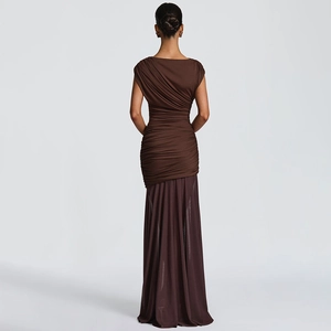 Detail of dark brown ruched bodice and flowing sheer skirt on a sleeveless maxi dress