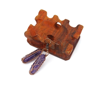 Handmade amethyst tree of life earrings with vintage wire wrapping on a wood display