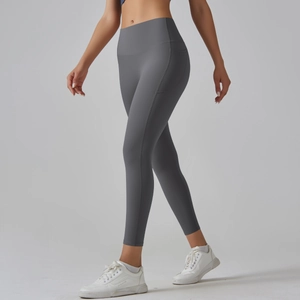 Detailed side view of high-waisted grey yoga pants featuring a practical side phone pocket