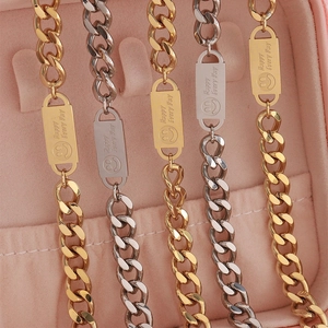 Cuban link bracelets with smiley face engravings in gold and silver stainless steel