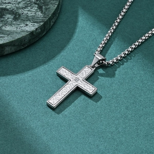 Vintage silver hammer-textured cross pendant necklace with small central crystal stone