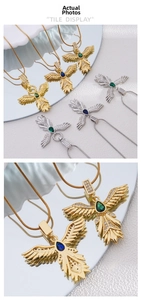 Detail of 18K gold plated eagle wing pendant with colorful gemstone and snake chain