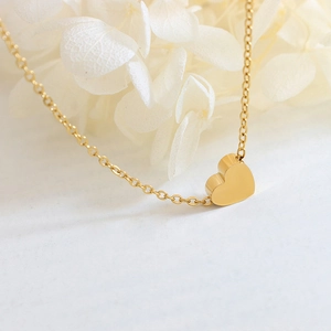 Minimalist 18K gold heart pendant necklace for women with a delicate O-chain link