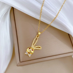 Golden titanium steel necklace with a crystal rabbit pendant and red gemstone eyes