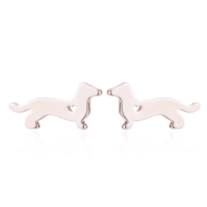Detailed macro view of rose gold dachshund stud earrings with heart cut-out accents