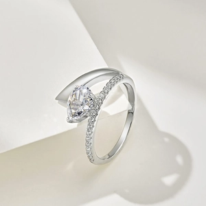 Close-up of S925 sterling silver ring with pear-cut diamond and cross band detail