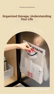 Close-up of a wall-mounted mesh storage bag for plastic bags in a cabinet