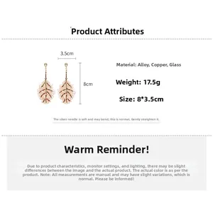 Detail view of crystal leaf earrings showing 8x3.5cm dimensions and silver needle pins