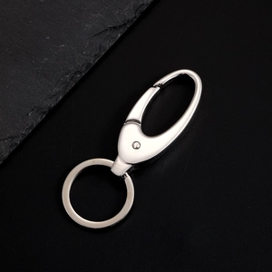 Close-up of polished stainless steel oval carabiner and flat ring keychain set