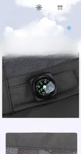 Close-up of outdoor sun hat with built-in compass and breathable mesh fabric detail