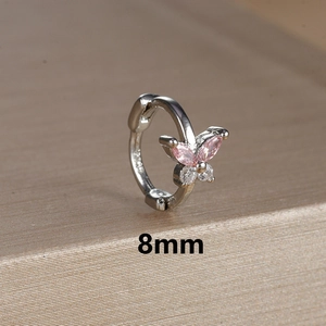 Macro detail of silver butterfly earring hoop with pink and white gems and 8mm size mark