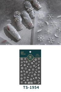 Detail of 3D embossed winter snowflake and feather nail stickers with pearl finish