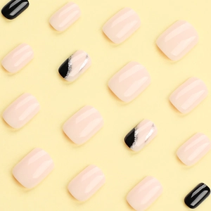 Short square press-on nail kit featuring nude pink, black, and silver glitter art designs