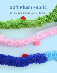 Detail showing soft plush pet cat sticks in vibrant green, pink, and blue fuzzy textures
